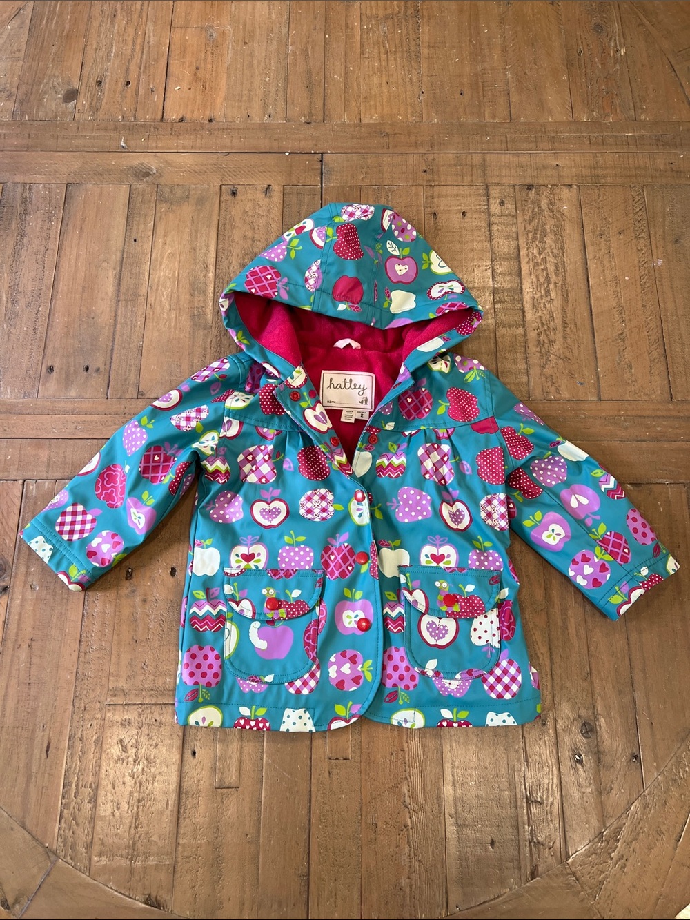 Hatley teal apple and worm print hooded raincoat girls 2T lined